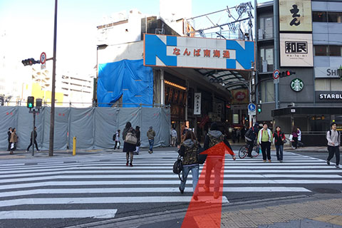 Across the crosswalk and forward into the arcade.